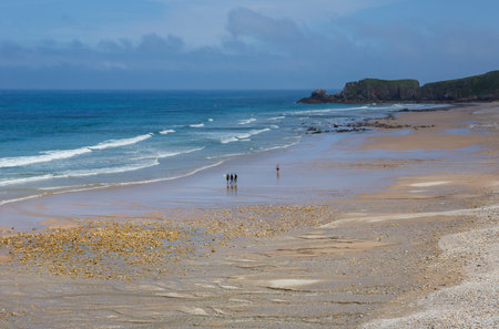 Llanes, Picos de Europa, Spain: People at the beach of San Antolin, Llanes, Asturias, Spainのeditorial素材