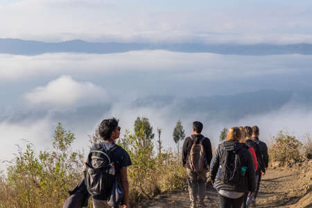 BALI, INDONESIA: Group of hikers at dawn on top of the Batur volcano in Bali, Indonesia.のeditorial素材