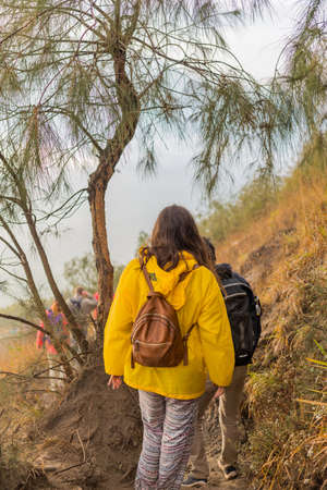 BALI, INDONESIA: Group of hikers at dawn on top of the Batur volcano in Bali, Indonesia.のeditorial素材