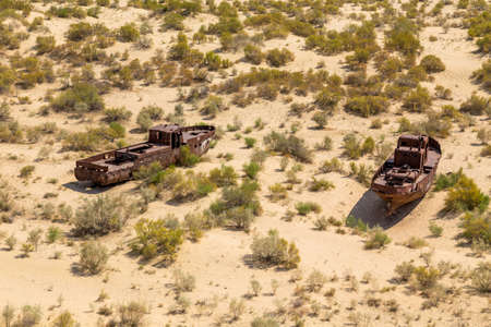 boats on a ship graveyard on a desert around Moynaq, Moynoq or Muynak - Aral sea or Aral lake - Uzbekistan, Central Asiaの写真素材