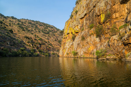 River Douro flowing through narrow rocky gorge in Portugal. Douro Region.の写真素材