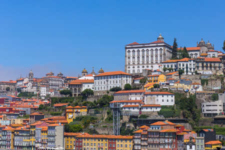 PORTO, PORTUGAL - JULY 28, 2019: the famous houses of the Ribeira in the Douro River bank near the Dom Luis I Bridge, Porto, Portugal.のeditorial素材