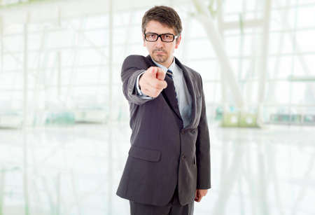 young business man pointing, at the officeの写真素材