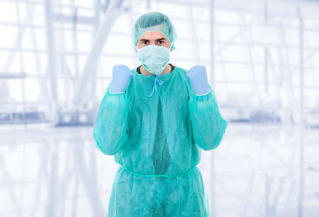 young male doctor winning at the hospitalの写真素材