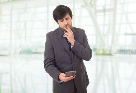 worried business man on the phone, at the officeの写真素材