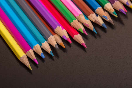 Wooden colorful pencils, on a dark backgroundの写真素材