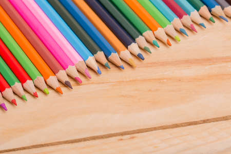 Wooden colorful pencils, on wooden tableの写真素材