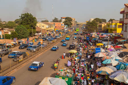 Bissau, Republic of Guinea-Bissau: Street scene in the city of Bissau with cars in a road, Guinea Bissauのeditorial素材