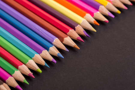 Wooden colorful pencils, on a dark backgroundの写真素材