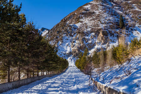Winter Snowy Mountains valley with sun in Ak Bulak, Almaty, Kazakhstan, Asiaの写真素材