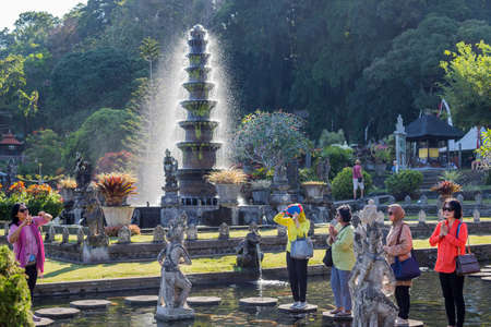 Bali, Indonesia: People praying on the stepstones of Tirtagangga Water Palace in Bali, Indonesiaのeditorial素材