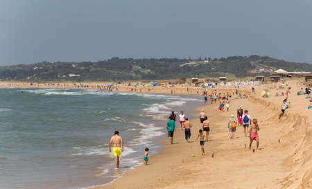 ALVOR, PORTUGAL: People at the famous beach of Praia do Alvor, Algarve region, Portugalのeditorial素材