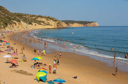 VILA DO BISPO, PORTUGAL: People at the famous beach of Salema in Vila do Bispo. This beach is a part of famous tourist region of Algarve.のeditorial素材