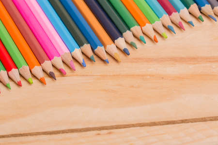 Wooden colorful pencils, on wooden tableの写真素材
