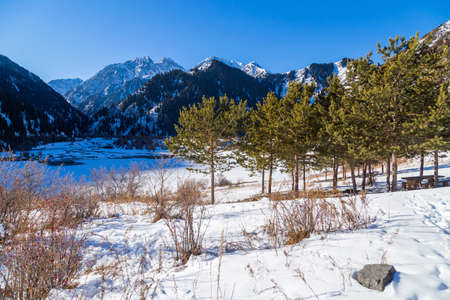Winter Snowy Mountains valley with sun in Ak Bulak, Almaty, Kazakhstan, Asiaの写真素材