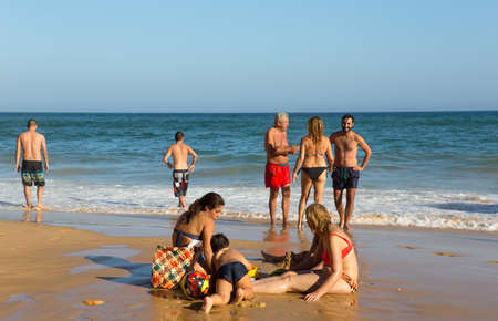 ALBUFEIRA, PORTUGAL: People at the famous beach of Olhos de Agua in Albufeira. This beach is a part of famous tourist region of Algarve.のeditorial素材