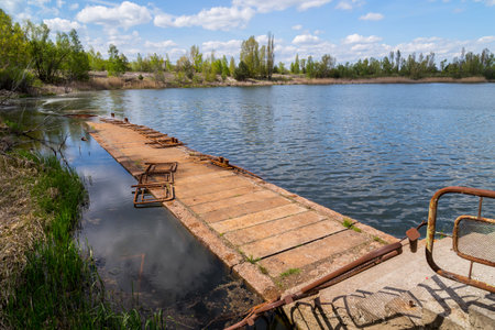 Lake in the town of Prypjat in Ukraine. Lake full of hazardous radioactive waste. after the nuclear disaster of Chernobylの写真素材