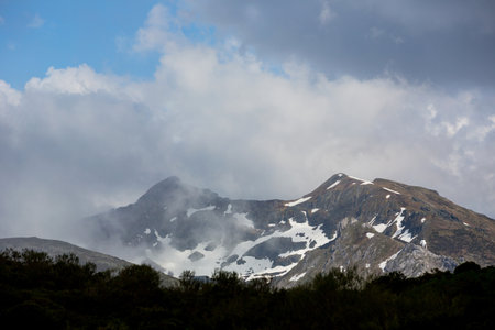 Mountain landscape in the Picos de Europa national park, Spain, Asturias. Snow on the mountain peaks.の写真素材