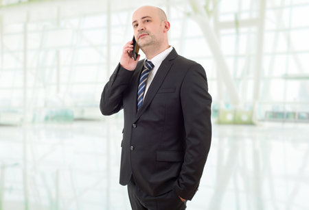 worried business man on the phone, at the officeの写真素材