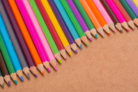 Wooden colorful pencils, on wooden tableの写真素材