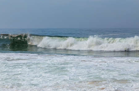 waves at a empty beach near Aveiro, Portugalの写真素材