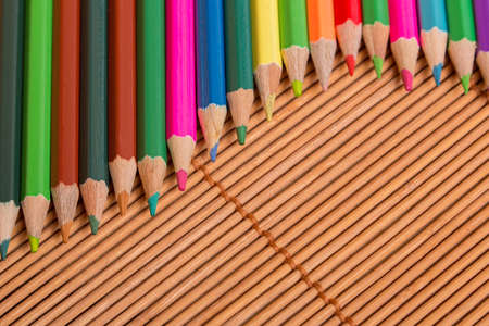 Wooden colorful pencils, on wooden tableの写真素材