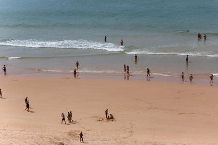 PRAIA DA ROCHA, PORTUGAL: People at the famous beach of Praia da Rocha in Portimao. This beach is a part of famous tourist region of Algarve.のeditorial素材