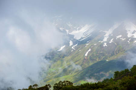 Mountain landscape in the Picos de Europa national park, Spain, Asturias. Snow on the mountain peaks.の写真素材