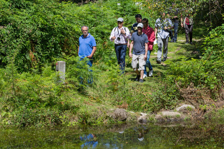 PAREDES DE COURA, PORTUGAL: Group of people hiking in the nature at Paredes de Couraのeditorial素材