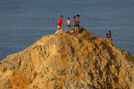 LAGOS, PORTUGAL: people at the famous Ponta da Piedade, Algarve region, Lagos, Portugalのeditorial素材