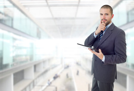 happy businessman working with a tablet pc, at the officeの写真素材