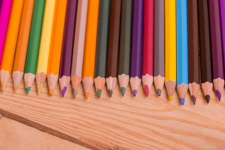 Wooden colorful pencils, on wooden tableの写真素材