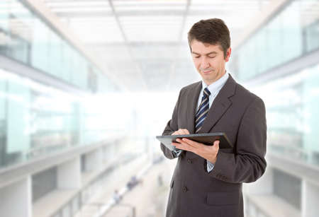 businessman using touch pad of tablet pc, at the officeの写真素材