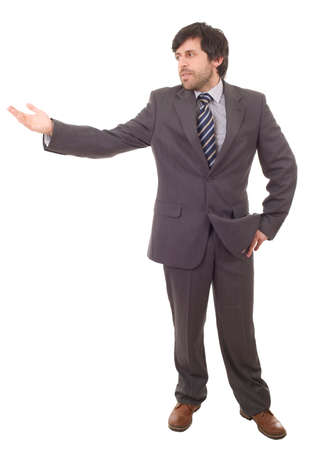Handsome businessman with arm out in a showing gesture, isolated on whiteの写真素材
