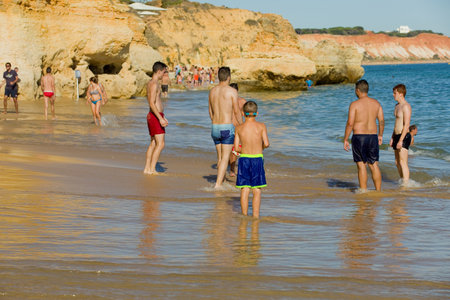 ALBUFEIRA, PORTUGAL: People at the famous beach of Olhos de Agua in Albufeira. This beach is a part of famous tourist region of Algarve.のeditorial素材