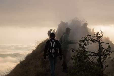 BALI, INDONESIA: Group of people watch the dawn on top of the Batur volcano in Bali, Indonesia.のeditorial素材