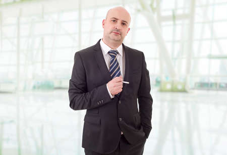 businessman smoking at the officeの写真素材
