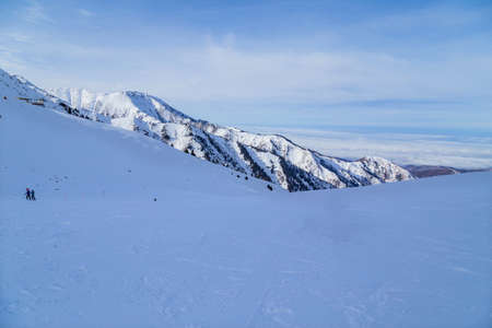 Winter Snowy Mountains with sun in Ak Bulak, Almaty, Kazakhstan, Asiaの写真素材
