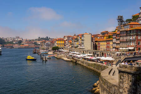 PORTO, PORTUGAL: the famous houses of the Ribeira in the Douro River bank near the Dom Luis I...