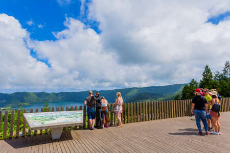 Sete Cidades, Sao Miguel, Azores island, Portugal: Tourists watching lagoa das Sete Cidades from Vista del Rei scenic viewpointのeditorial素材