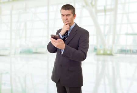 worried business man on the phone, at the officeの写真素材