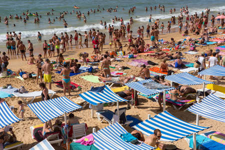 ALBUFEIRA, PORTUGAL: People at the famous beach of Olhos de Agua in Albufeira. This beach is a part of famous tourist region of Algarve.のeditorial素材