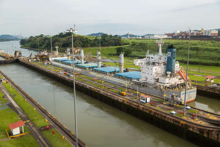 GATUN, PANAMA: Container ship is passing through Gatun Locks, part of Panama Canal.のeditorial素材