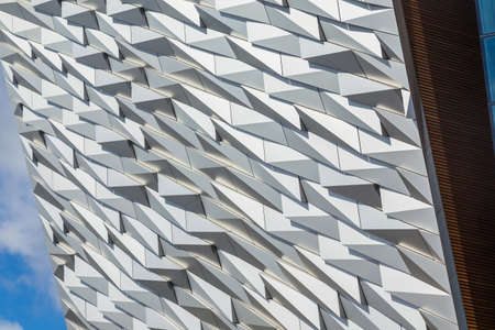 Detail of the facade of Titanic Belfast, museum, touristic attraction and monument to Belfast's maritime heritageのeditorial素材