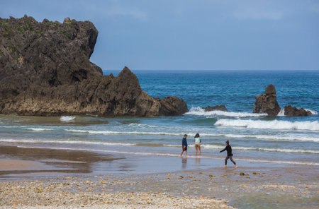 Llanes, Picos de Europa, Spain: People at the beach of San Antolin, Llanes, Asturias, Spainのeditorial素材