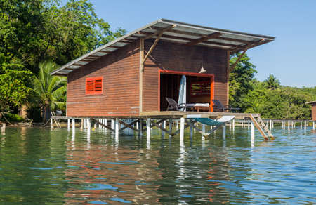 Colorful Caribbean buildings over the water with boats at dock, Bocas del Toro, Panamaのeditorial素材