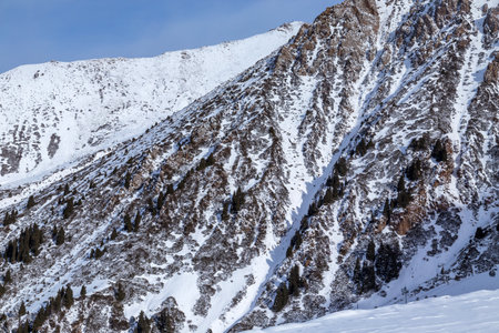 Winter Snowy Mountains valley with sun in Ak Bulak, Almaty, Kazakhstan, Asiaの写真素材