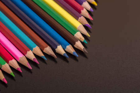 Wooden colorful pencils, on a dark backgroundの写真素材