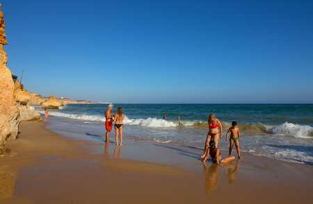 ALBUFEIRA, PORTUGAL: People at the famous beach of Olhos de Agua in Albufeira. This beach is a part of famous tourist region of Algarve.のeditorial素材