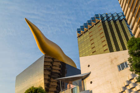 Tokyo. Japan: Asahi Beer buildings. Sunny day. Blue sky. Asahi Breweries headquarters building with the Asahi Flameのeditorial素材